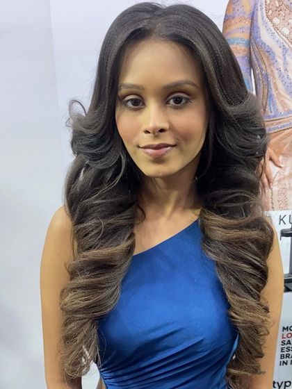 A beautiful shot of a model with voluminous, face-framing curls from my live demo at the Beauty & Spa Expo.