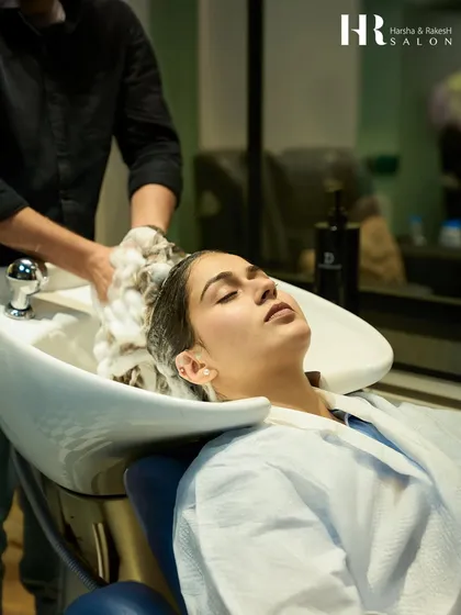 A moment of pure bliss during a hair wash and spa treatment. We use premium products and a gentle touch to cleanse and prepare the hair for deep conditioning, ensuring a truly pampering experience.