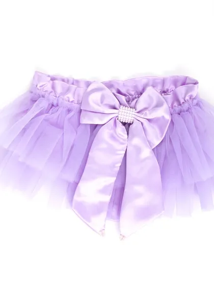A product shot of the lavender tutu skirt with a large bow.