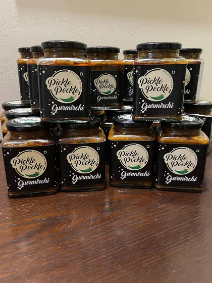 A fresh batch of my bestselling Gurmirchi pickle, all bottled up with the Pickle Pockle label and ready for my customers.