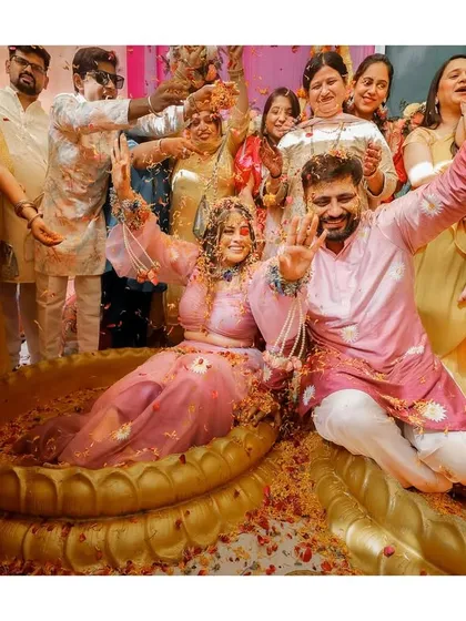 The pure, unadulterated joy of a Haldi ceremony. We capture the high-energy moments as friends and family shower the happy couple with flower petals, creating a memory filled with laughter and vibrant color.