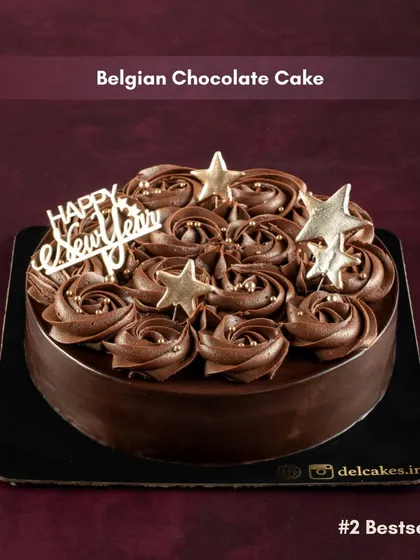 Our Belgian Chocolate Cake, another bestseller for New Year's, decorated with a "Happy New Year" topper and golden stars.