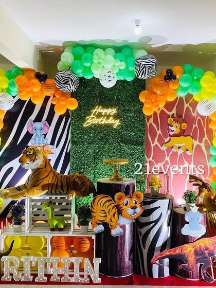 A full view of the action-packed jungle safari theme for a first birthday.