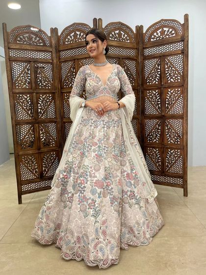 A smiling shot in the floral lehenga, showing how this pre-loved piece can make you feel effortlessly beautiful and ready for any celebration.
