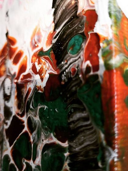 A view of the side of the "Autumn" canvas, showing how the paint drips and continues the artwork around the edges.