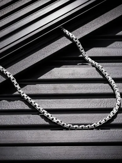 This shot for Orionz Jewels highlights our skill in capturing difficult subjects like metal and intricate details. Using textured black panels and directional lighting, we created dramatic shadows and contrast to give this men's chain a bold, masculine, and high-end feel.