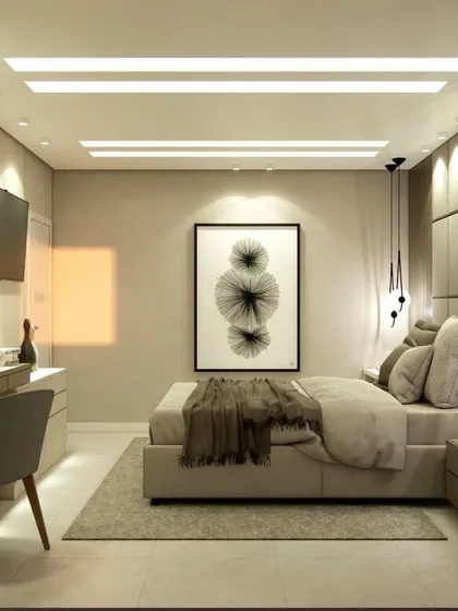 A wider view of the master bedroom, showing the bed, dressing table, and the overall spacious layout.