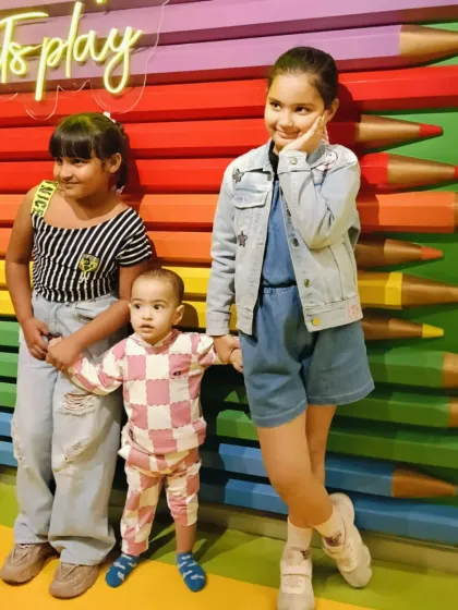 Siblings and friends of different ages can all find fun things to do together, as shown in this cute photo by our colorful pencil wall.