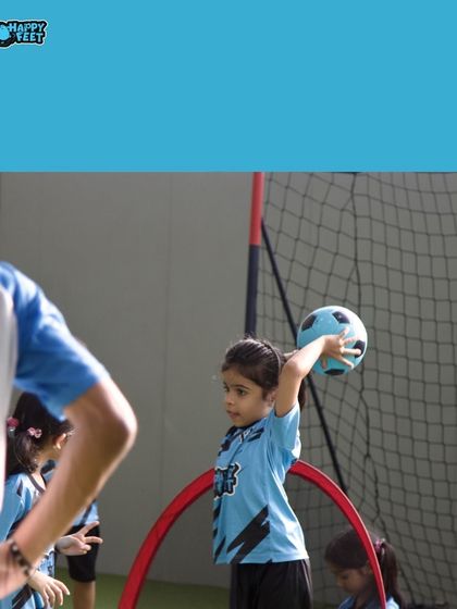 A little moment captured during a throwing drill. Her focused expression and big effort result in big smiles all around. It's these small achievements that build confidence.