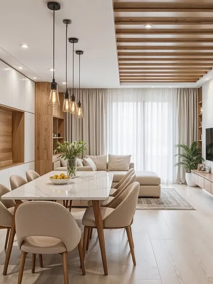 This design showcases how to integrate living, dining, and storage seamlessly. The wooden ceiling detail defines the dining area, while the open bookshelf adds character to the living space.