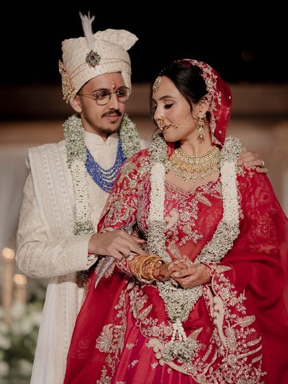 A beautiful portrait of the newly married couple, moments after their varmala ceremony. The joy and love between them is what inspires every detail of our work.