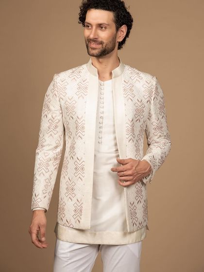 A candid shot of the pastel embroidered jacket, showing how it moves with the wearer. The design is both visually striking and comfortable, perfect for a long day of celebrations.
