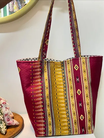 We love giving old treasures new life. This stylish and sturdy tote bag was crafted from a client's treasured saree pallu, blending traditional fabric with a modern, practical design.