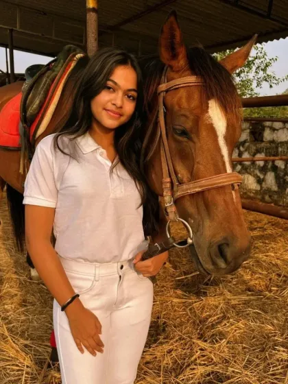 A beautiful portrait of a rider and her horse, showcasing the connection and trust we foster at our club.