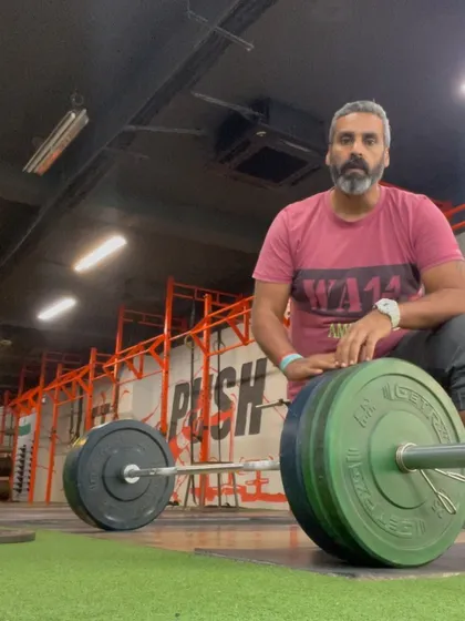 Taking a moment after a heavy deadlift set. This exercise is one of the best for building pure, functional strength, but it demands focus and respect for the weight.