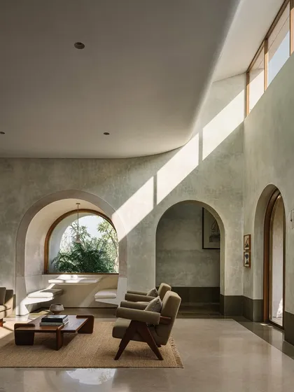 Inside the Dua Villa, we used light as a primary building material. Clerestory windows and curved ceilings sculpt the interior, casting dynamic shafts of sunlight that transform the living space throughout the day, creating a home that feels alive and connected to the outdoors.