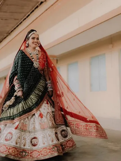 A full-length shot of my gorgeous bride, her happiness shining through. The entire look, from the lehenga to the makeup, came together perfectly.