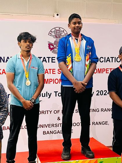Apoorva on the podium after winning a silver medal in the youth men's team event.
