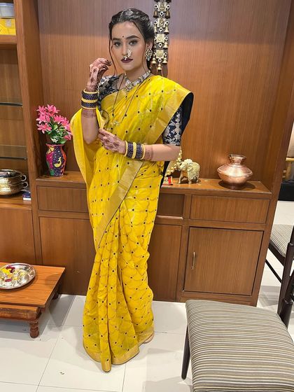 The full view of this royal yellow saree look, perfect for making a statement at any celebration.