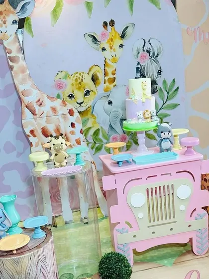 This shot showcases the cute illustrated animals on the backdrop, which are designed to be sweet and friendly for a young child's party.
