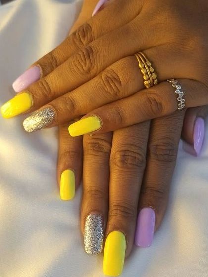 Colorblock nails, anyone? This client opted for a gorgeous combination of neon pastel yellow and lilac with a hint of silver glitter.