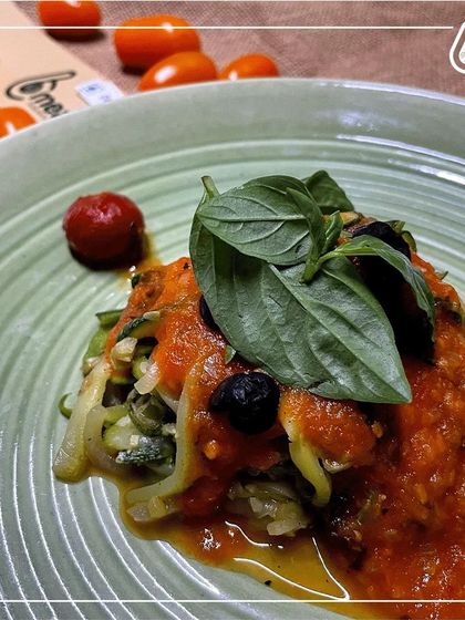 Our zucchini lasagna is a low-carb, gluten-free twist on the Italian classic. We use layers of zucchini instead of pasta, with a rich tomato sauce and fresh basil.
