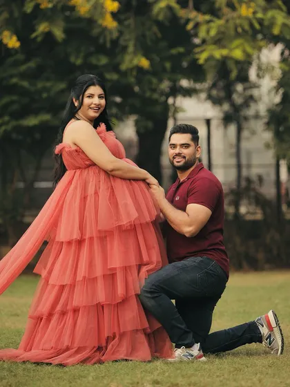 Another sweet pose from the maternity shoot. The gown's design allows for comfort and movement, making the photoshoot experience enjoyable.
