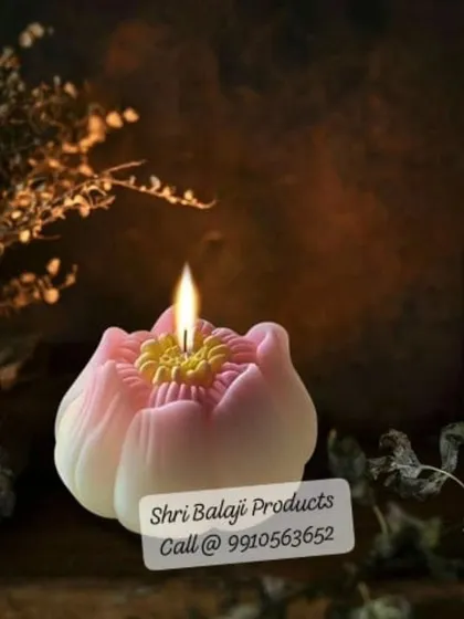 A beautifully lit lotus candle, showcasing its intricate details. I am always working on bringing new and creative mold designs to my students and customers.