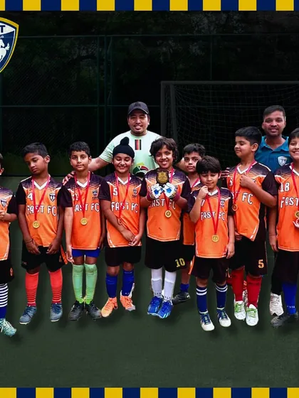 Our U13 team and coaches pose with their medals after winning the Millennium Football Tournament in Gurgaon.
