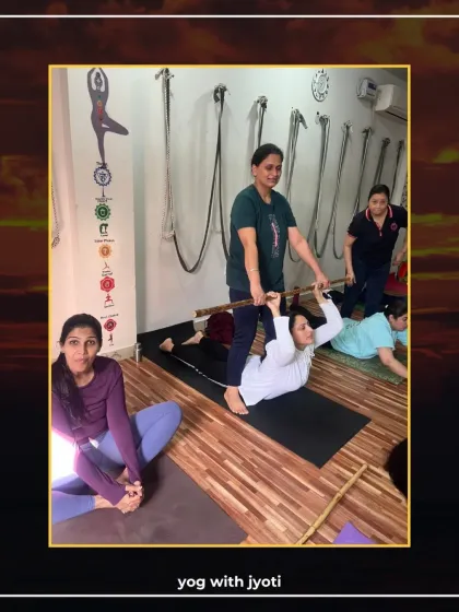 Using a stick as a prop, I help a student achieve a deeper backbend in this assisted stretch.