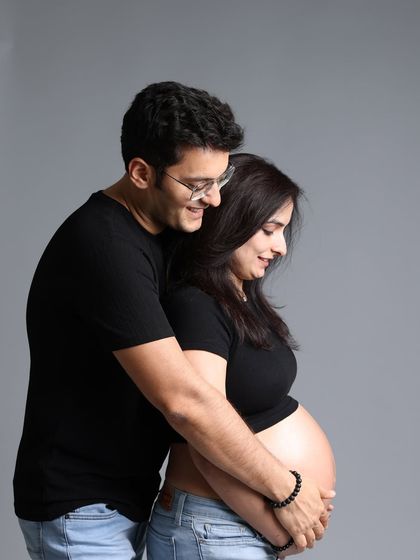 Side by side, heart to heart, this is where their story grows. A sweet, candid moment capturing the couple's journey to parenthood.