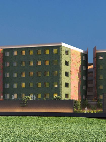 Another view of the commercial project with a green facade. This space is a testament to business excellence, with every detail meticulously designed to create an environment where professionalism meets architectural brilliance.