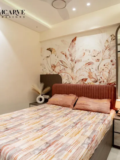 A full view of the bed and feature wall, showcasing the balance of pattern and simplicity.