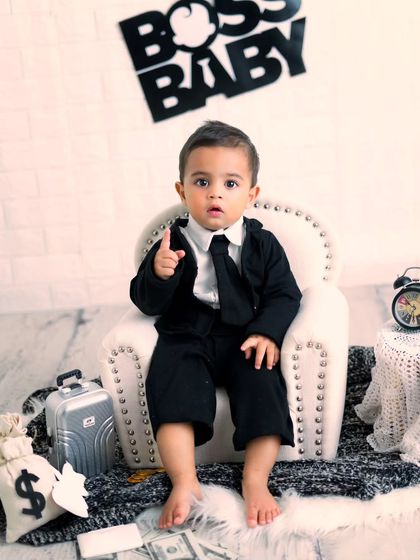 The Boss Baby is back and cuter than ever. This little one is pointing, ready to make a deal in this fun and stylish themed session.