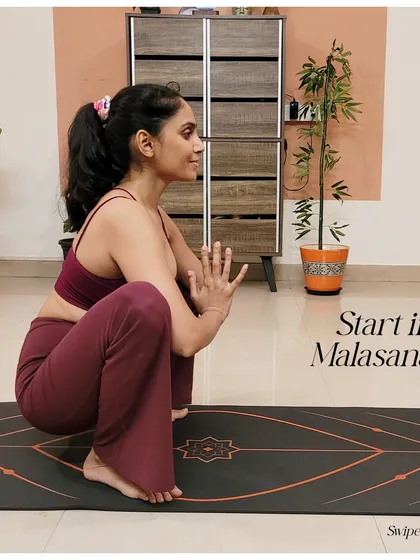 To begin your journey to crow pose, start in Malasana, or a low squat. This opens the hips and prepares the body for the arm balance.