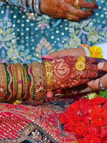 The beautiful engagement mehndi for Fazila, with her and her partner's initials 'AF' and 'FA' on her palms.