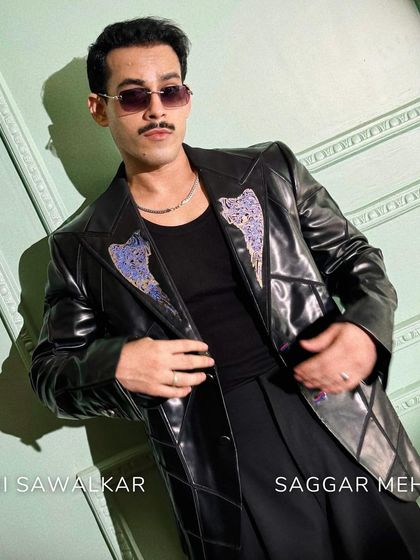 A closer look at Giri Sawalkar in the Enigma Set. The hand-stitched buttonholes and tropical trousers with side leather edging make this a statement of edgy elegance.