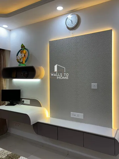 A modern, space-efficient unit that combines the TV console with a sleek, curved study desk. The integrated backlighting connects both zones, making it perfect for a bedroom or living area.