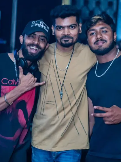 Connecting with fellow DJs and friends at White Lotus Club. The camaraderie in the music scene is one of the best parts of the job.