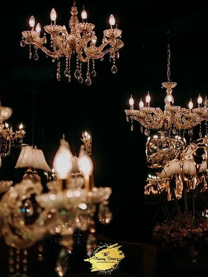 Lighting is everything. I curated a collection of exquisite chandeliers of different styles and sizes to hang at varying heights, creating a magical, star-lit effect against the dark night.