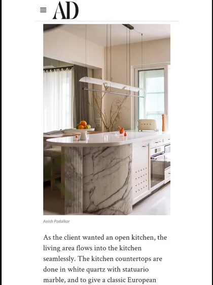Another snippet from our Architectural Digest feature, highlighting the open kitchen and the use of Statuario marble.