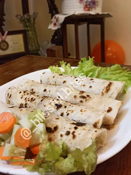 A platter of my Smokey Chicken Rolls, ready to be served. These rolls are a hearty and satisfying snack, perfect for a party or a quick meal.