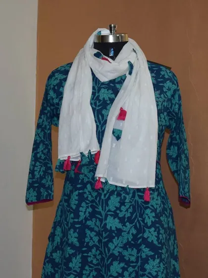 A close-up of the blue kurti's neckline, styled with the lightweight white dupatta. This shows how simple accessories can elevate a cotton kurti.