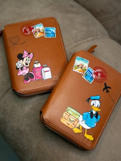 The full set of Disney-themed travel passport covers, a perfect gift for a couple who loves to travel.