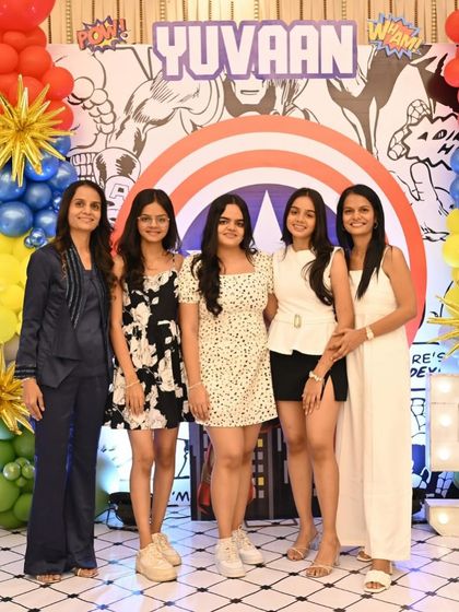 A lovely group of guests posing in front of the Captain America shield backdrop. Creating beautiful photo opportunities for everyone is a key part of my design process.