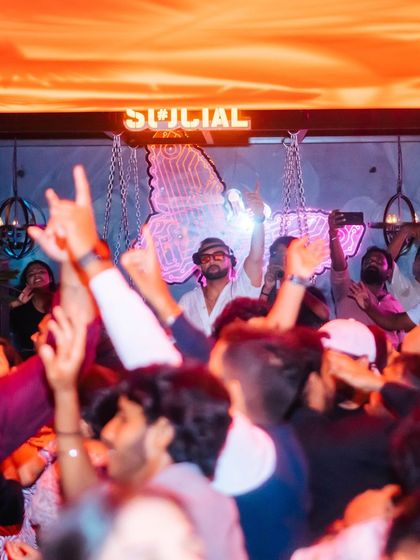 Me with my hands up, surrounded by the crowd. I'm not just playing for them; I'm partying with them.