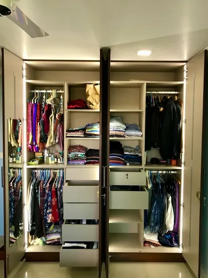 A look inside our exquisite Cane Door Wardrobe. The interior is just as important as the exterior, with integrated lighting, multiple hanging sections, and drawers for organized storage.
