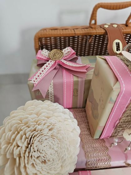 A close-up of a gift from the pretty pink trunk. The combination of patterned paper, a lace-trimmed ribbon, and a custom wax seal shows my commitment to beautiful details.