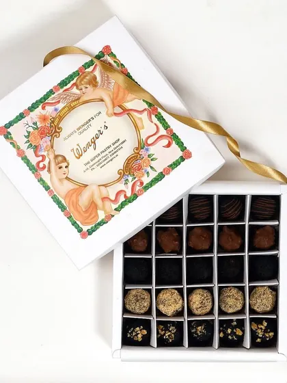 A box dedicated purely to our handmade chocolate truffles and pralines. Inside, you will find a curated selection of dark chocolate truffles, coconut-dusted pralines, and nut-filled chocolates.