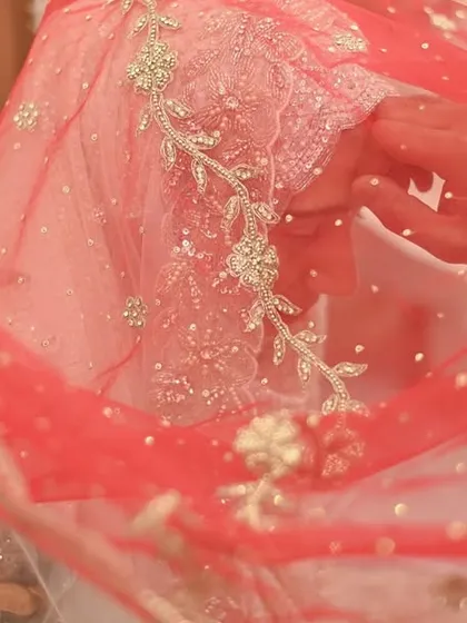 The delicate embroidery on a bride's red dupatta. I love focusing on these small, beautiful details that make up the bride's complete wedding day look.